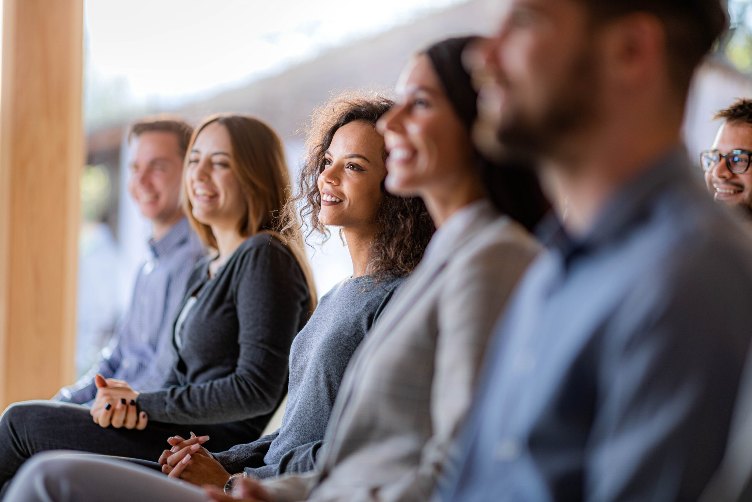 Happy Businesswoman Attending A Seminar In Board Room 
